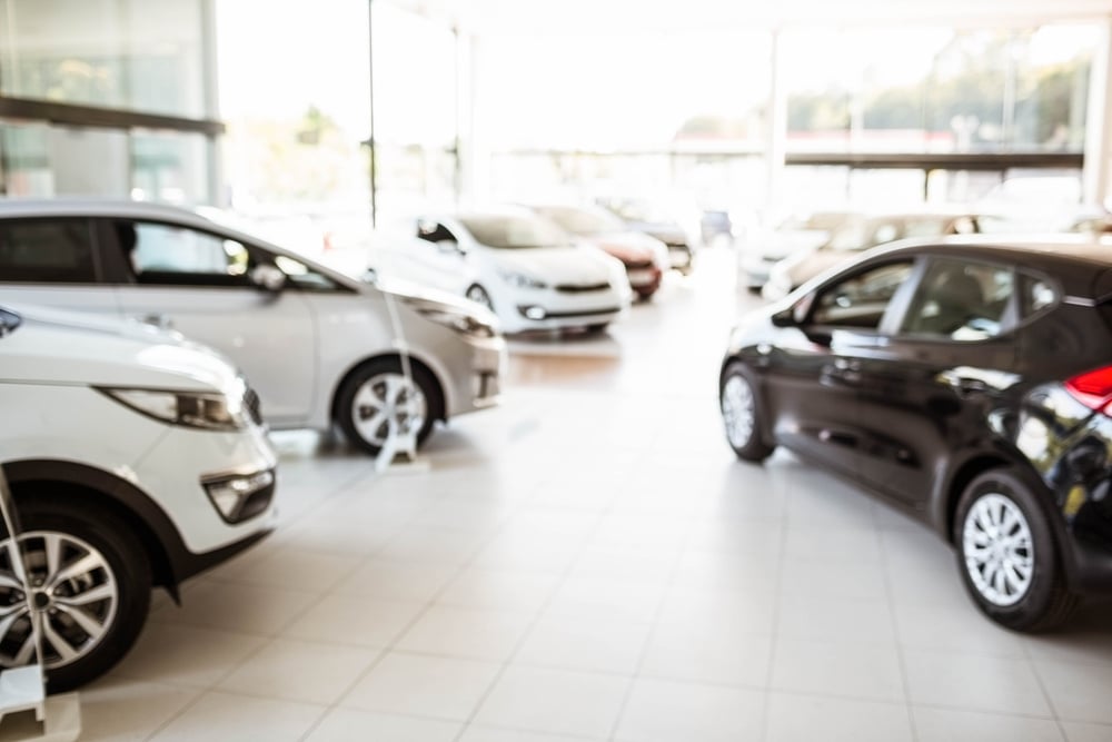 View of row of cars at car dealership